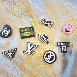 A lot of 9pcs Various Brands shoe charm